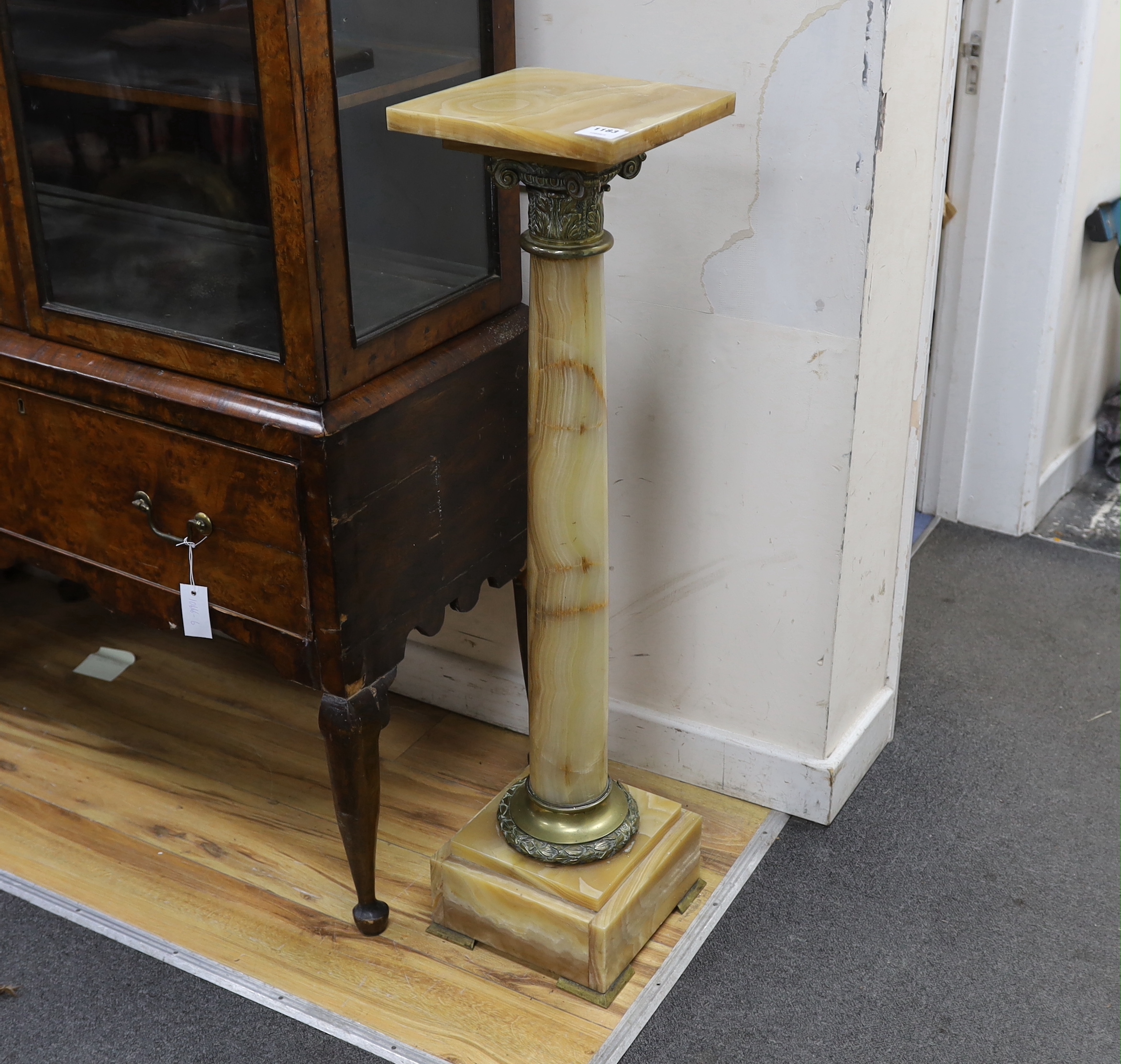 A gilt metal mounted and onyx pedestal, width 25cm, height 103cm